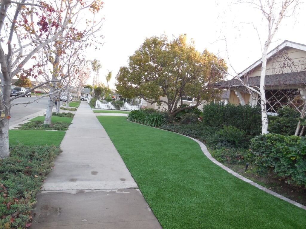 Artificial grass side yard with sidewalk