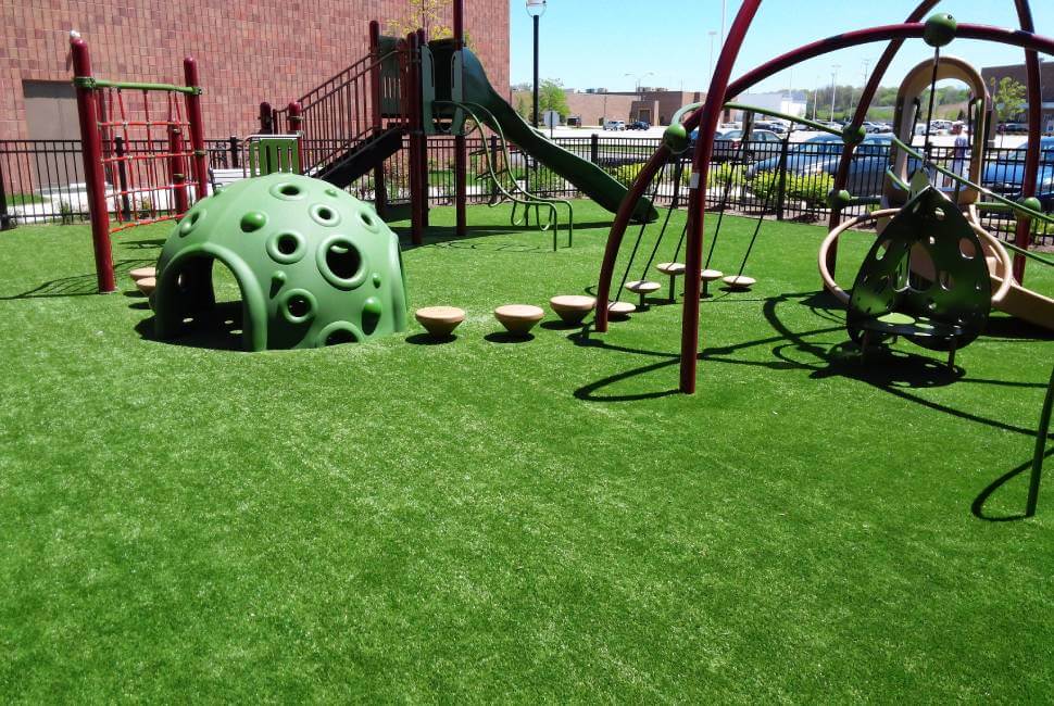 Green play ground equipment installed on Artificial Playground grass