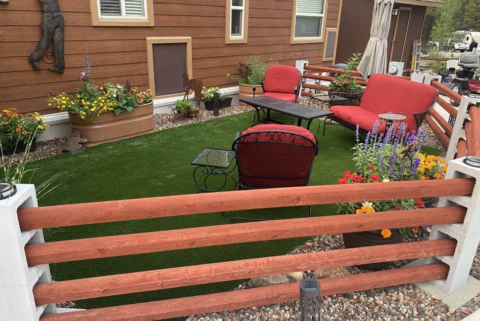 Artificial grass backyard with red furniture