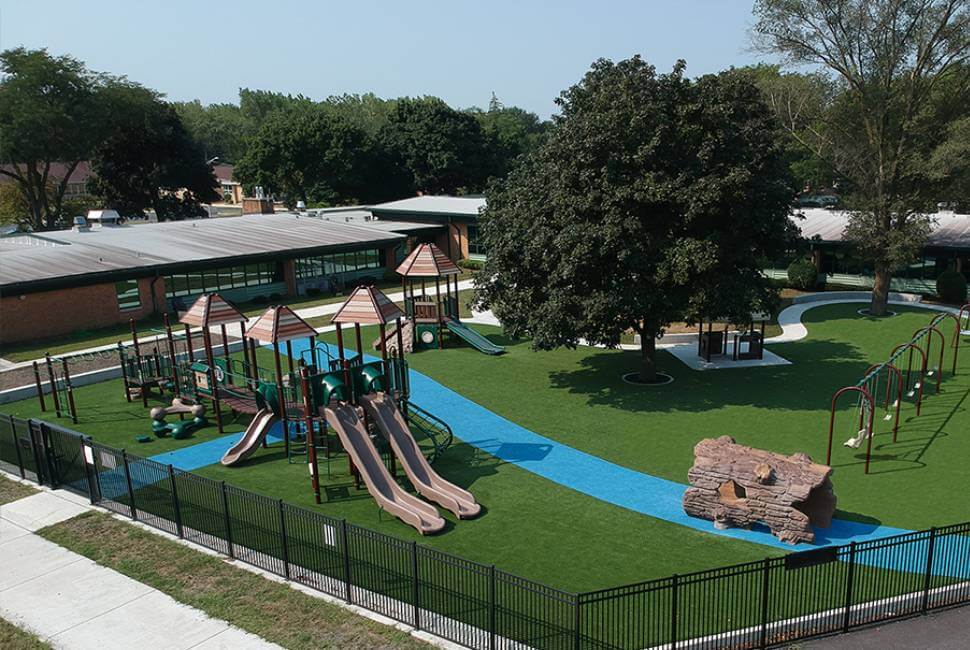 Drone shot of artificial grass school playground