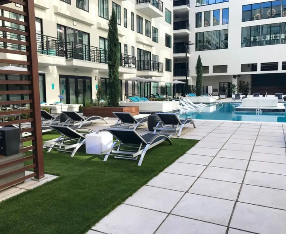 Artificial grass pool area at apartment